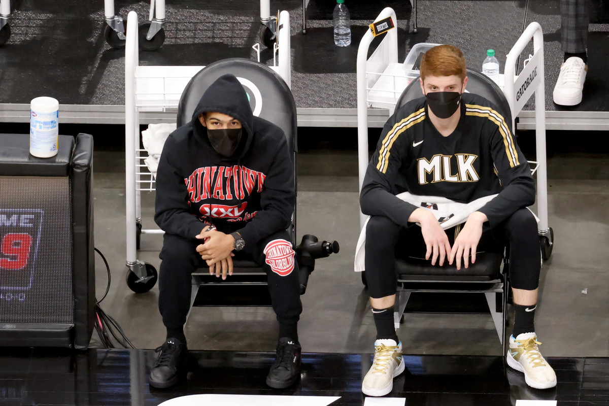 Atlanta Hawks guard Trae Young (left) and guard Kevin Huerter sit on the bench during the second quarter against the Miami Heat at State Farm Arena.